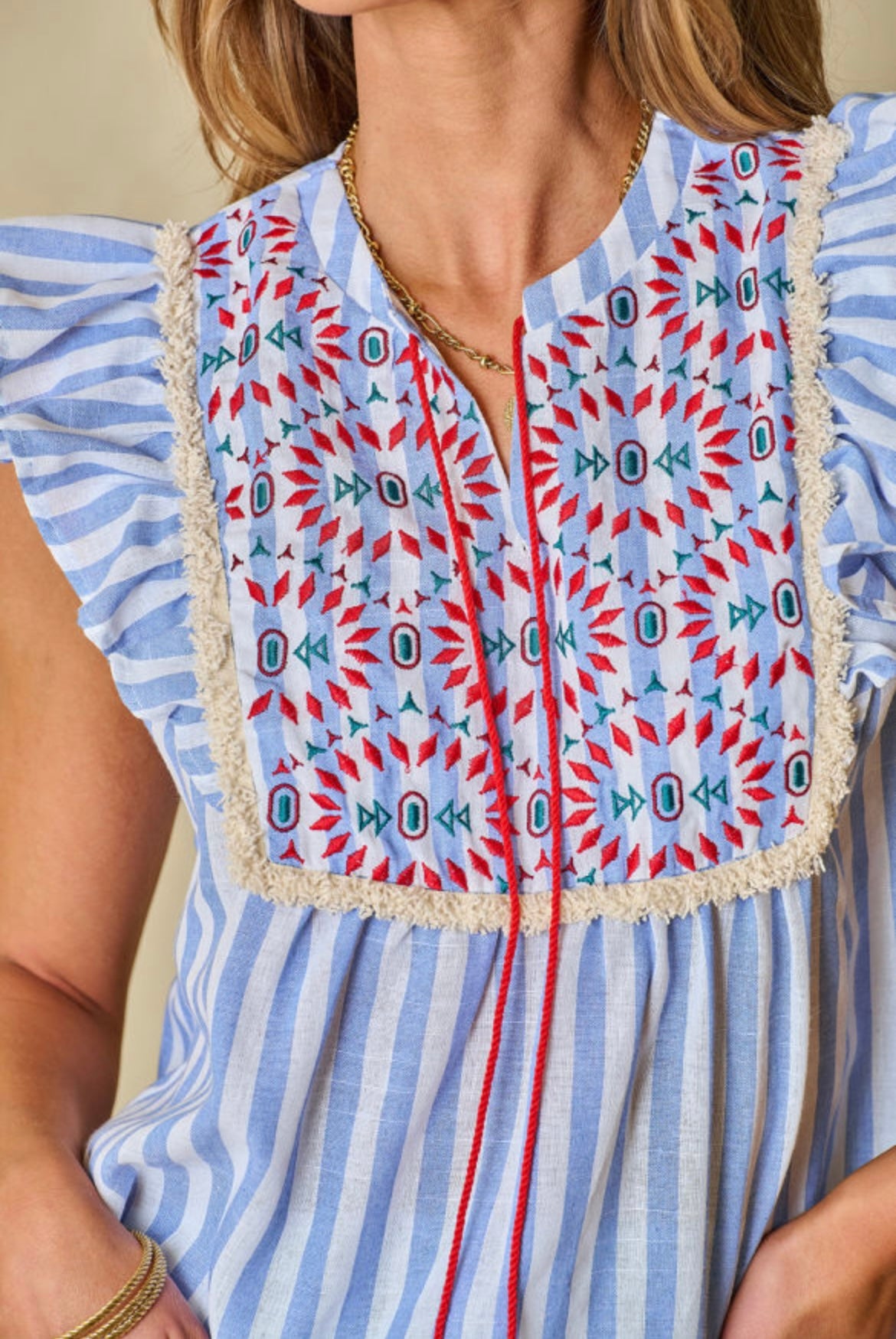 Embroidered tassel flutter blouse