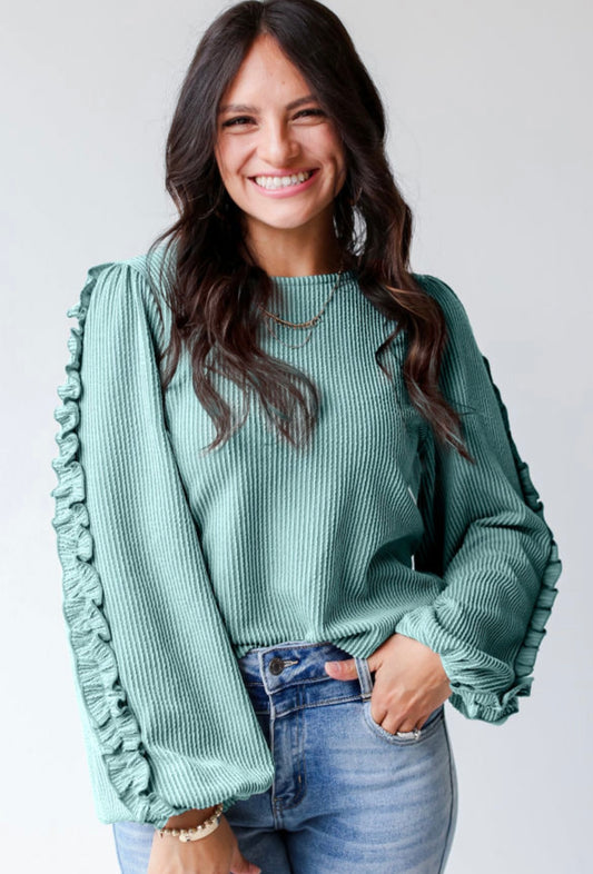 Textured blouse with sleeve detail